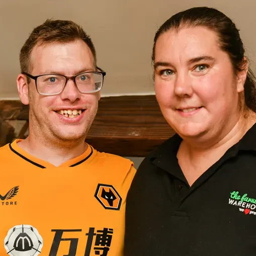 A happy couple with learning disabilities in their home, a supported living flat from Fairoak Housing Association